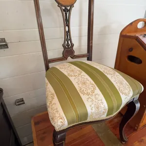 1800s vintage Wood side chair with floral and musical motif inlaid crest. Features decorative carved