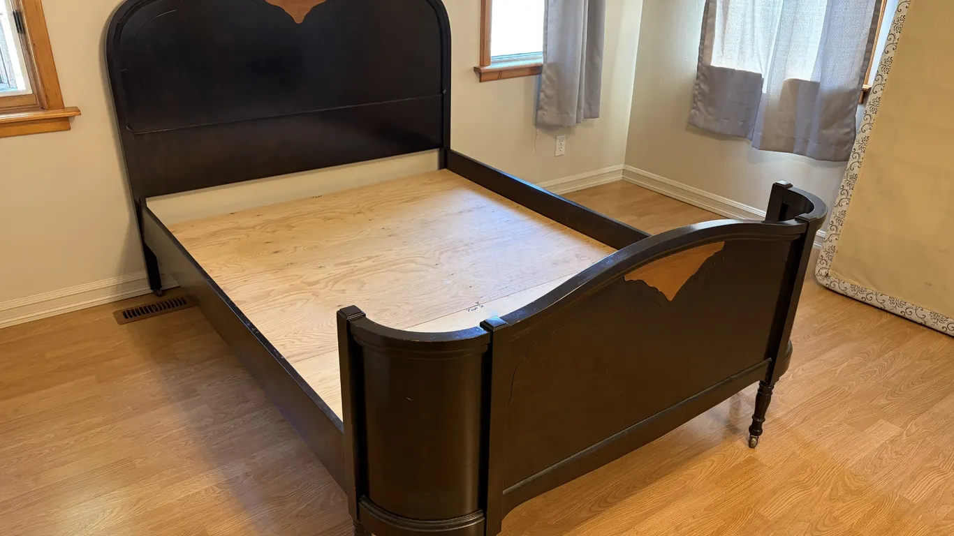 Wooden double bed frame with a decorative wood inlay feature on both the headboard and footboard. T