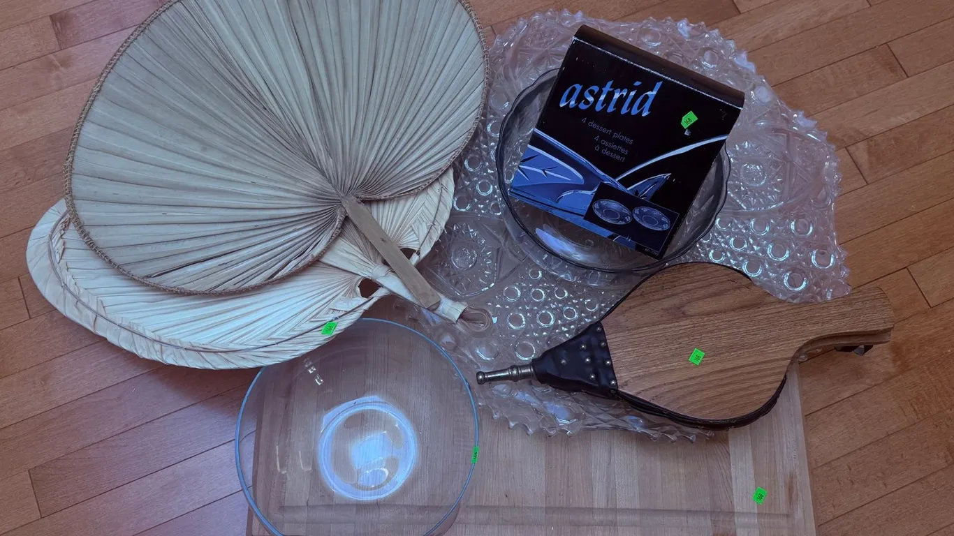 Household Items Including Palm Leaf Fans, Glassware, and Fireplace Bellows