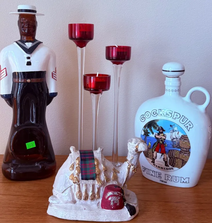 Decor Group: Glass Sailor Decanter, Cockspur Rum Jug, Red Candleholders, Camel Figurine