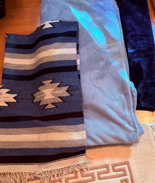 Blue and Neutral-Coloured Blankets and Rugs