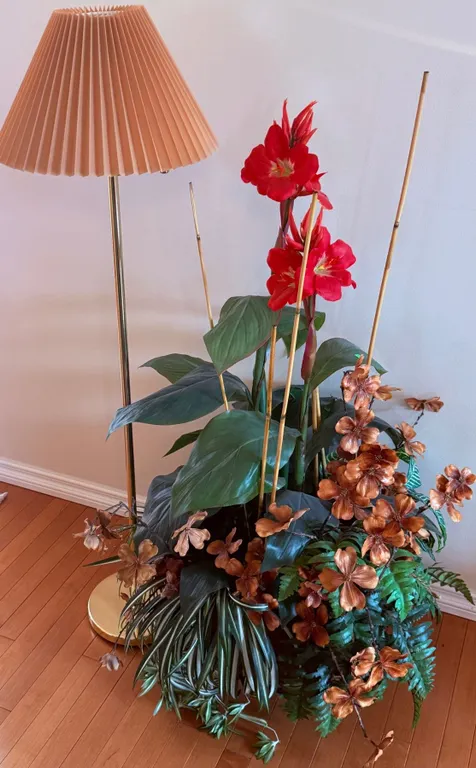 Brass Floor Lamp with Pleated Shade and Artificial Floral Arrangement