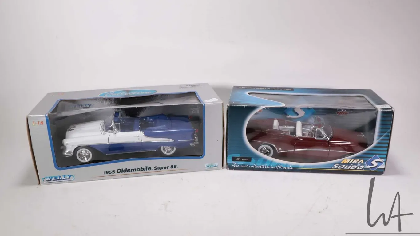 2 1:18 scale collectible die cast cars including Welly 1955 Oldsmobile Super 88 and a Solido 1953 Bu