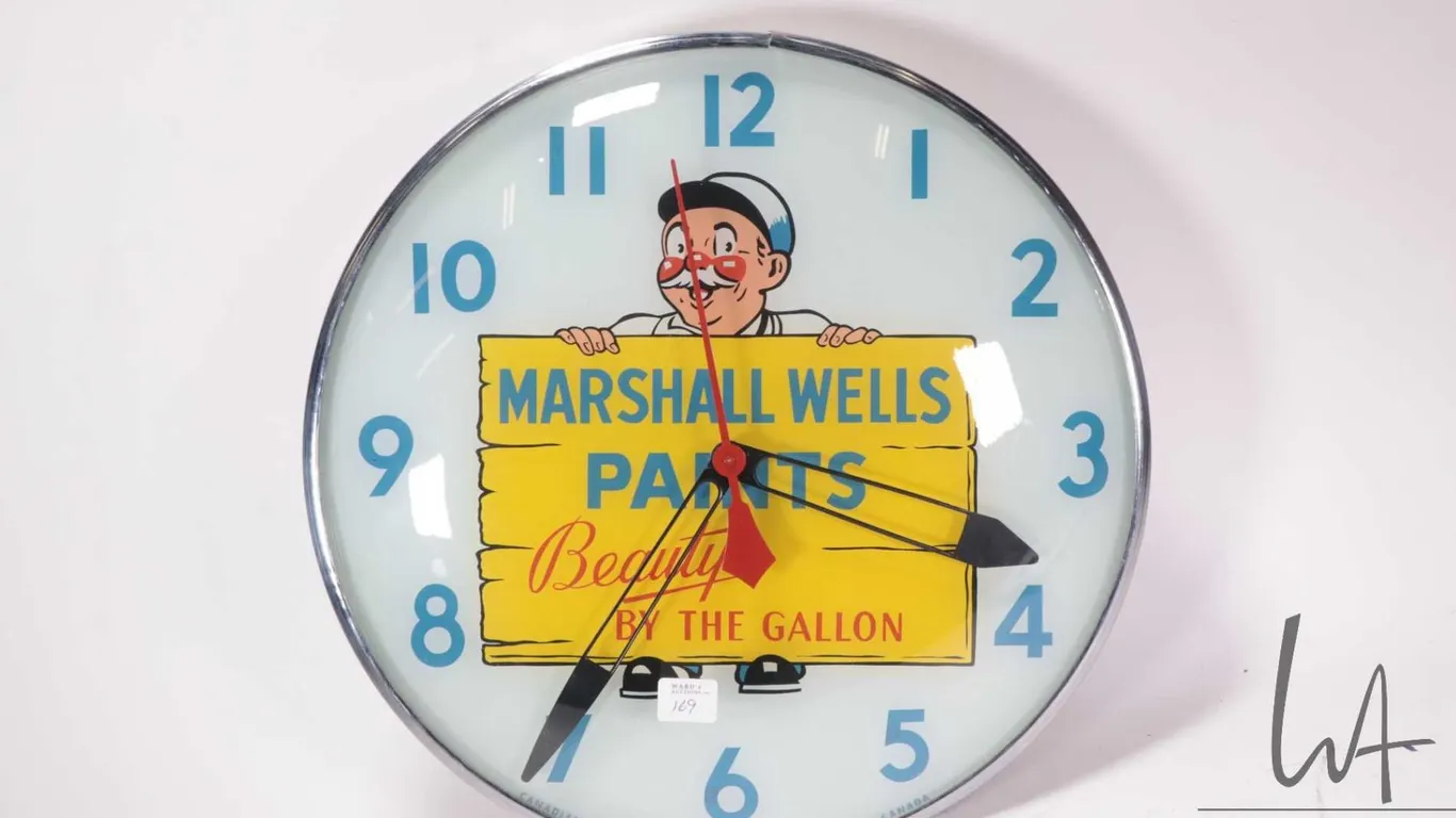 Vintage Canadian Neon-Ray clock company "Marshall Wells Paints" wall clock with glass face and light