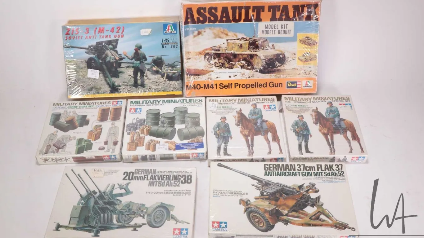 Eight 1:35 scale model kits WWII vehicle model kits including Revel, one Italari and six Tamiya all