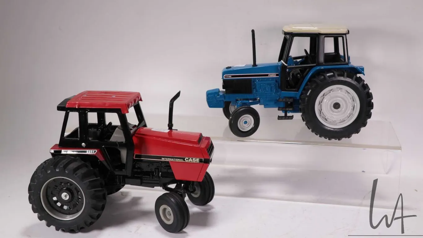 Two Ertl 1:18 scale die cast tractors including a Case 2594 and a Ford 7740