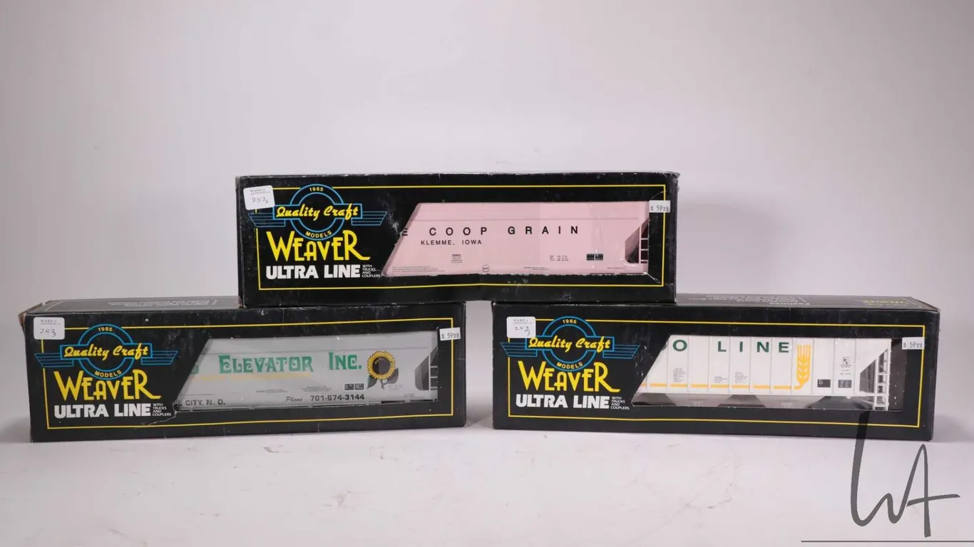 Three Weaver Ultra Line O gauge train cars including Soo Line grain car, Farmer's Elevator grain car
