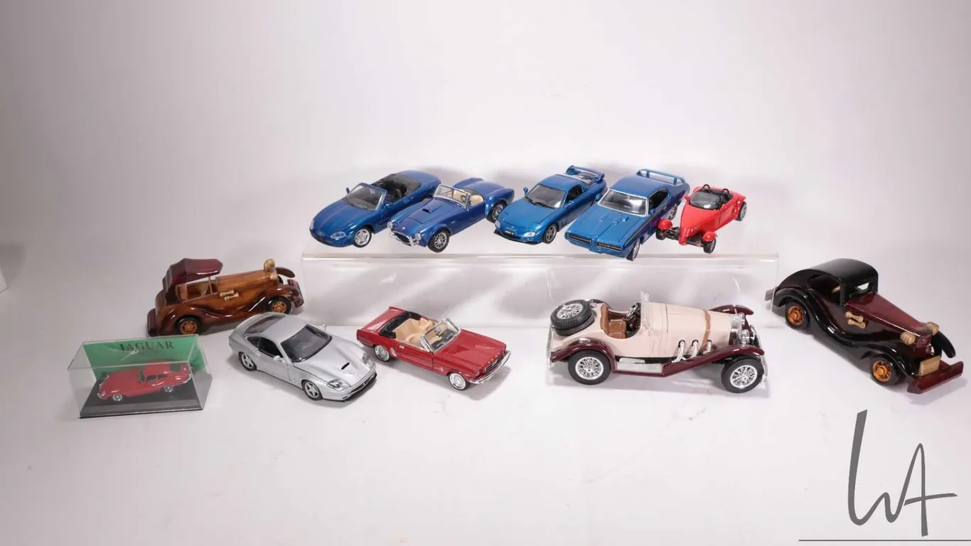 Selection of metal and wooden model cars including Burago 1928 Mercedes-Benz SSK, Burago Cobra 427,