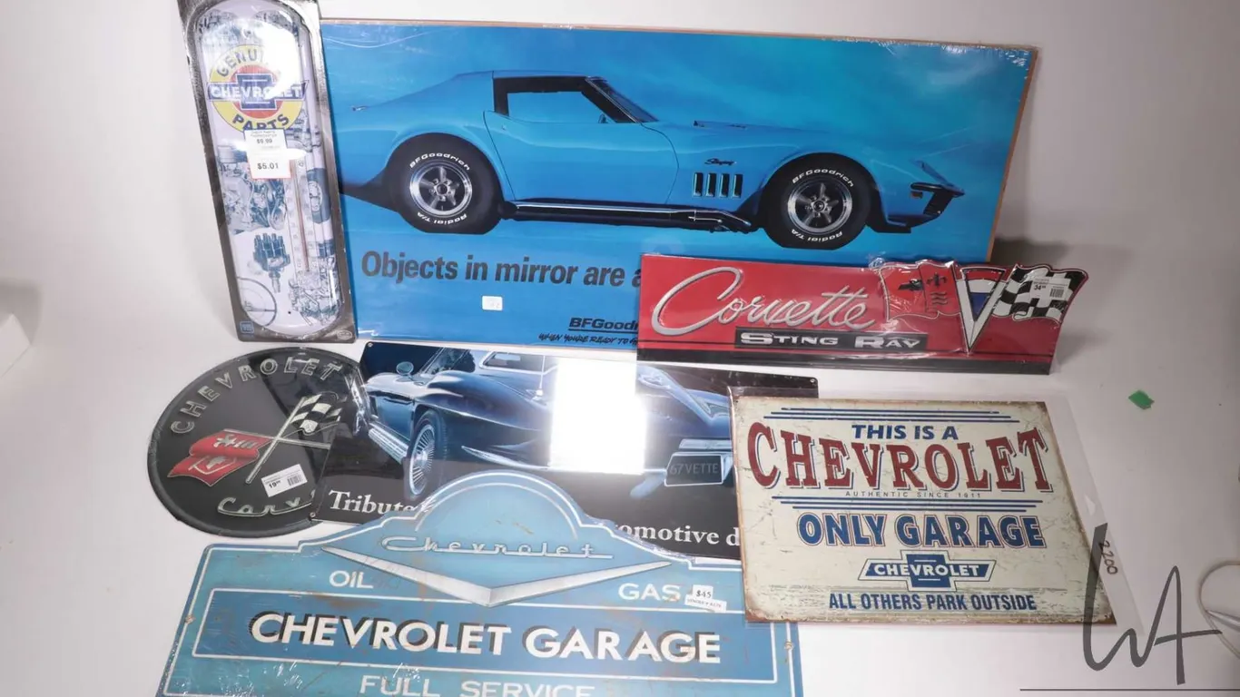 6 reproduction metal Chevy and Corvette wall signs, plus a BF Goodrich Corvette poster