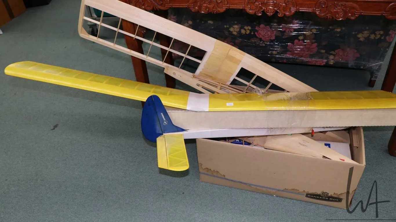 Three partially built wooden airplane kits, including Aerobipe R-C Sport Biplane, completeness not c