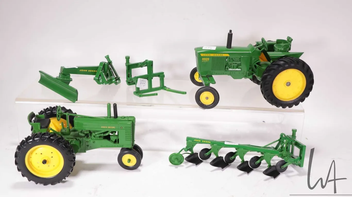 Two Ertl 1:18 scale die cast John Deere tractors including a Model A Rowcrop and a 4020 diesel plus