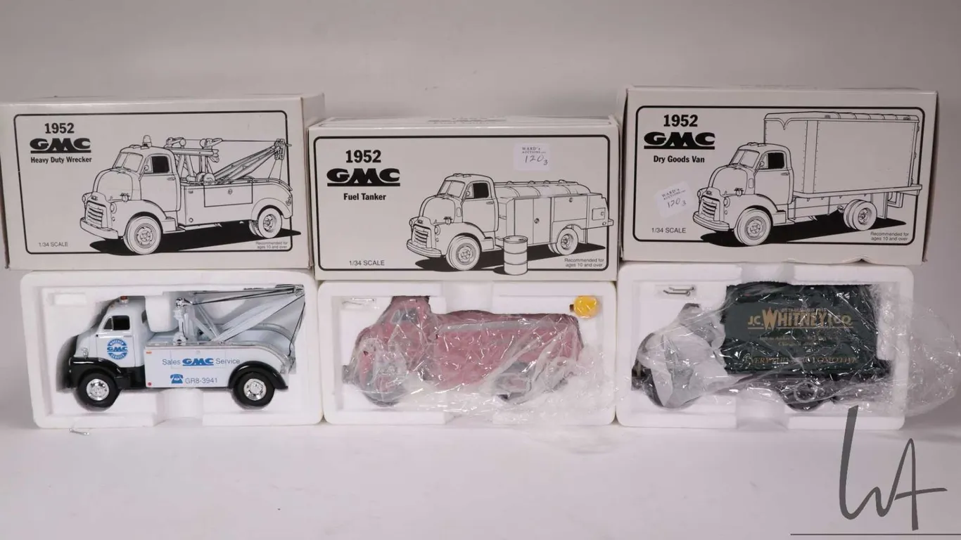 Three1st Gear 1:34 scale die cast 1952 GMC trucks including a Dry Goods Van, Heavy Duty Wrecker and