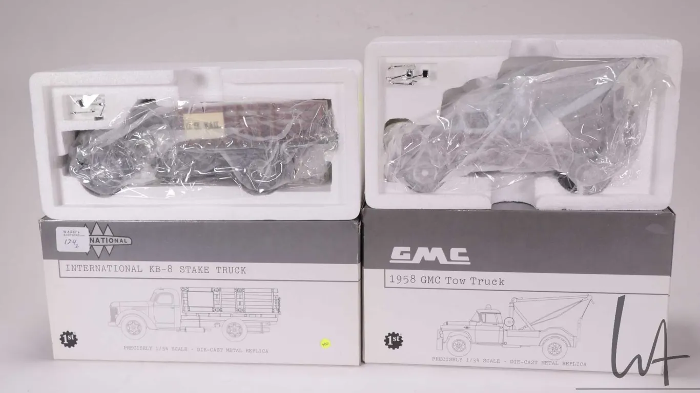 1st Gear 1:34 scale die cast vehicles including 1958 GMC Tow Truck and a International KB-8 Stake Tr