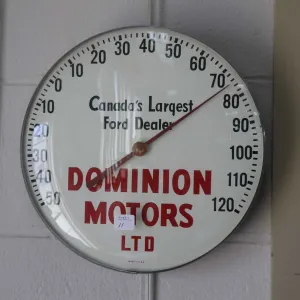 Vintage Dominion Motors Ltd. advertising thermometer, 12" in diameter
