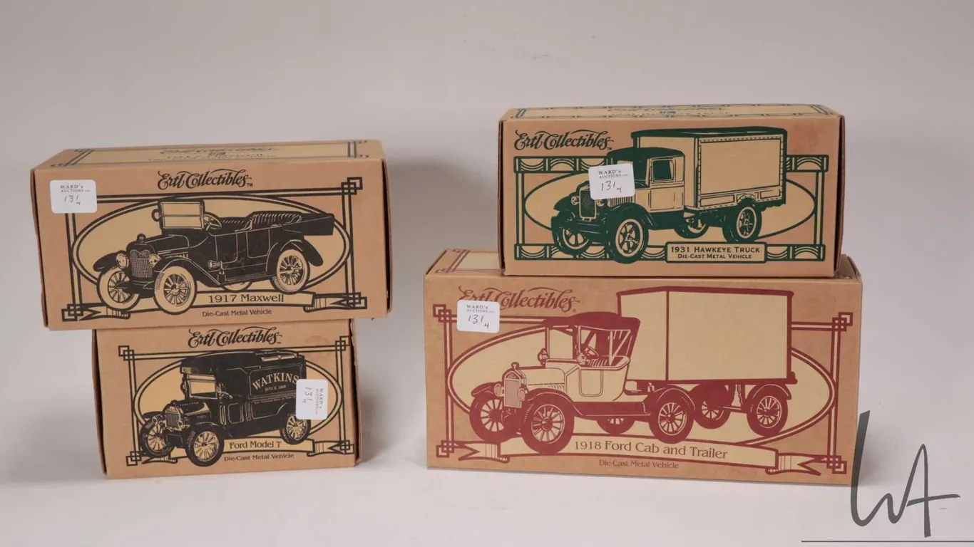 Four Ertl collectible die cast banks including 1931 Hawkeye Truck, 1917 Maxwell, Ford Model T and a