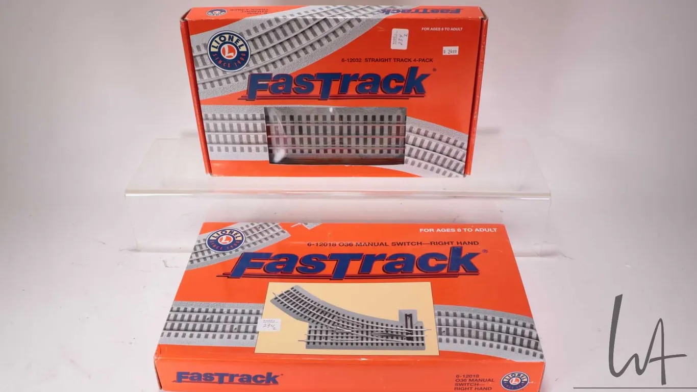 Two boxes of Lionel O gauge Fastrack including 6-12028 O36 Manual Switch right hand and 6-12032 Stra