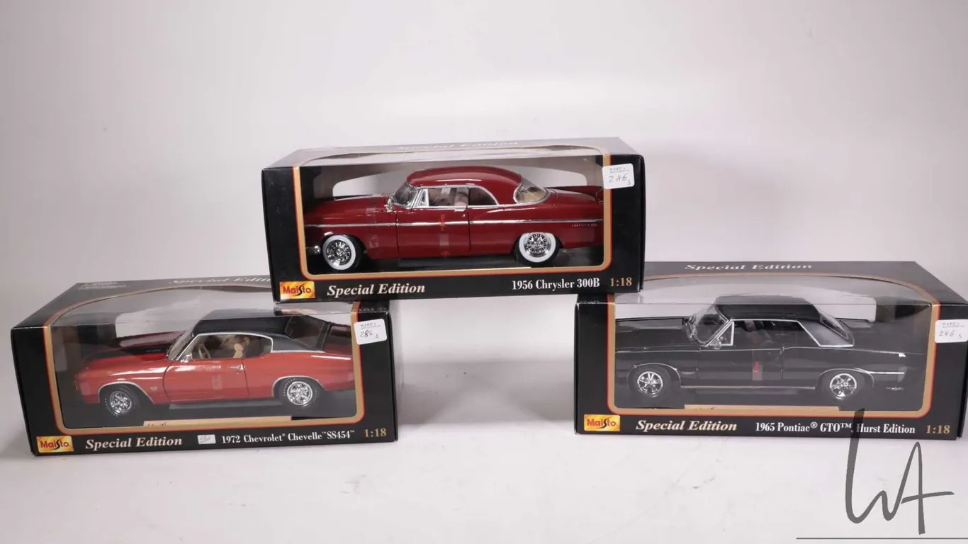 Three Maisto die cast model cars including 1956 Chrysler 300 B, 1965 Pontiac GTO Hurst Edition and a