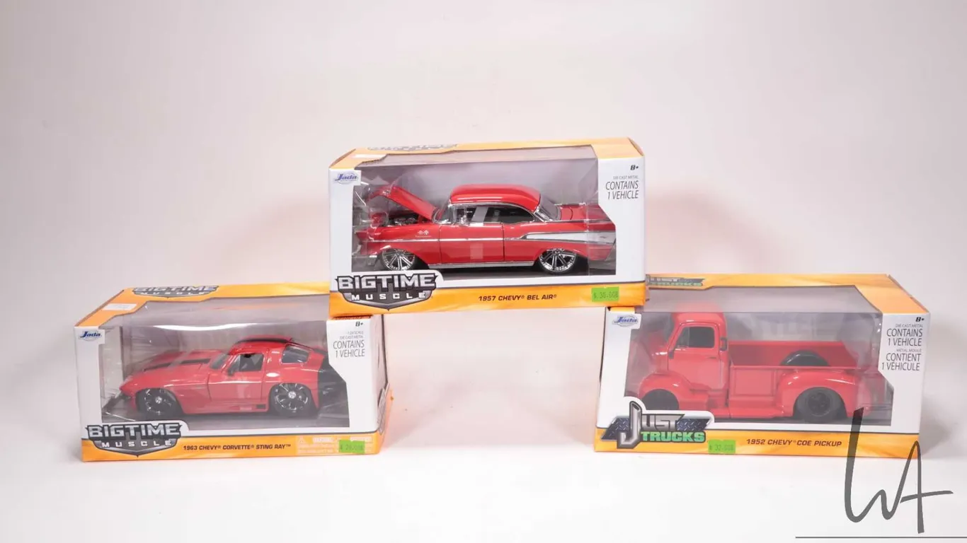 3 1:24 scale Jada die cast miniature model cars including 1963 Corvette, 1957 Chevrolet Belair, and