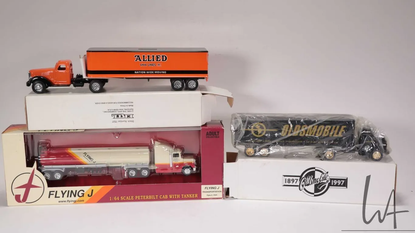 Three Ertl 1:64th scale truck and tractor units including Allied Van Lines die cast bank, 100 Years