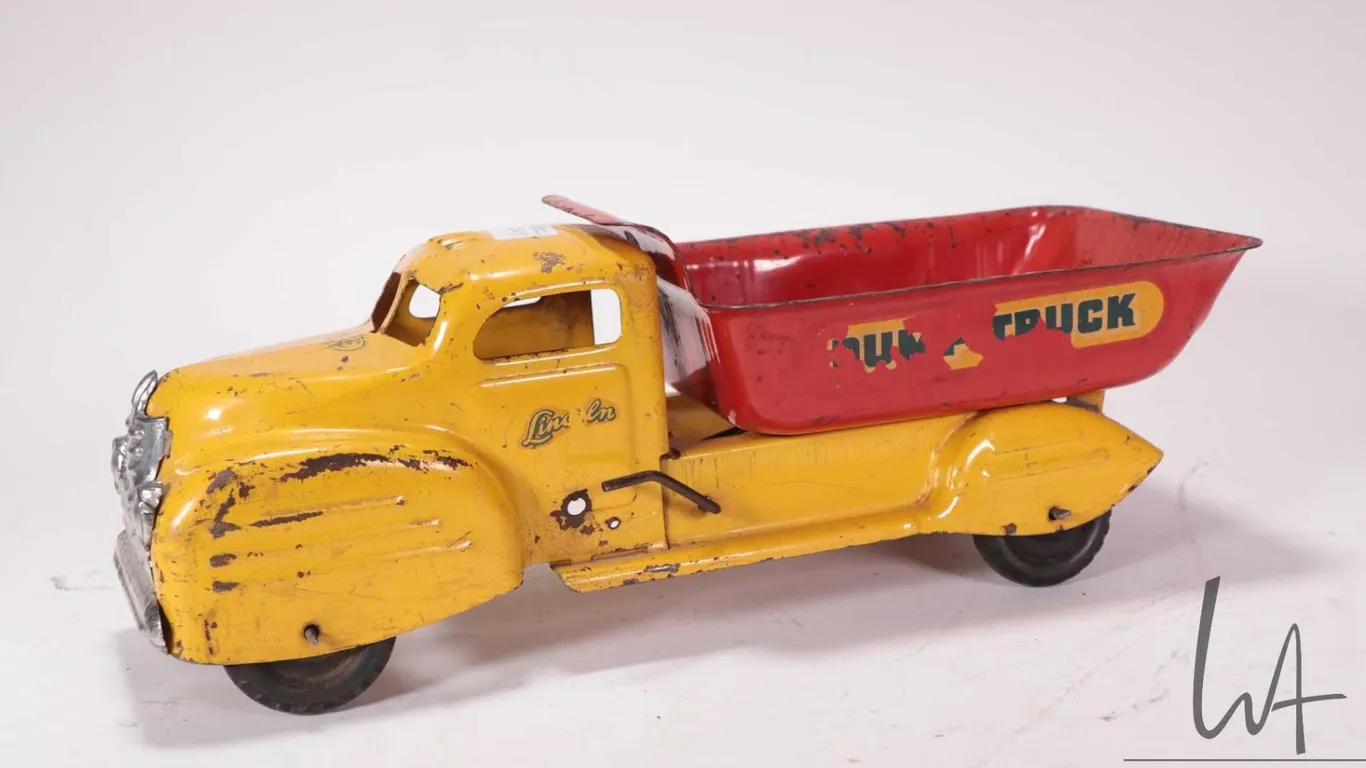 Vintage Lincoln pressed steel dump truck circa late 1940's, 14" in length