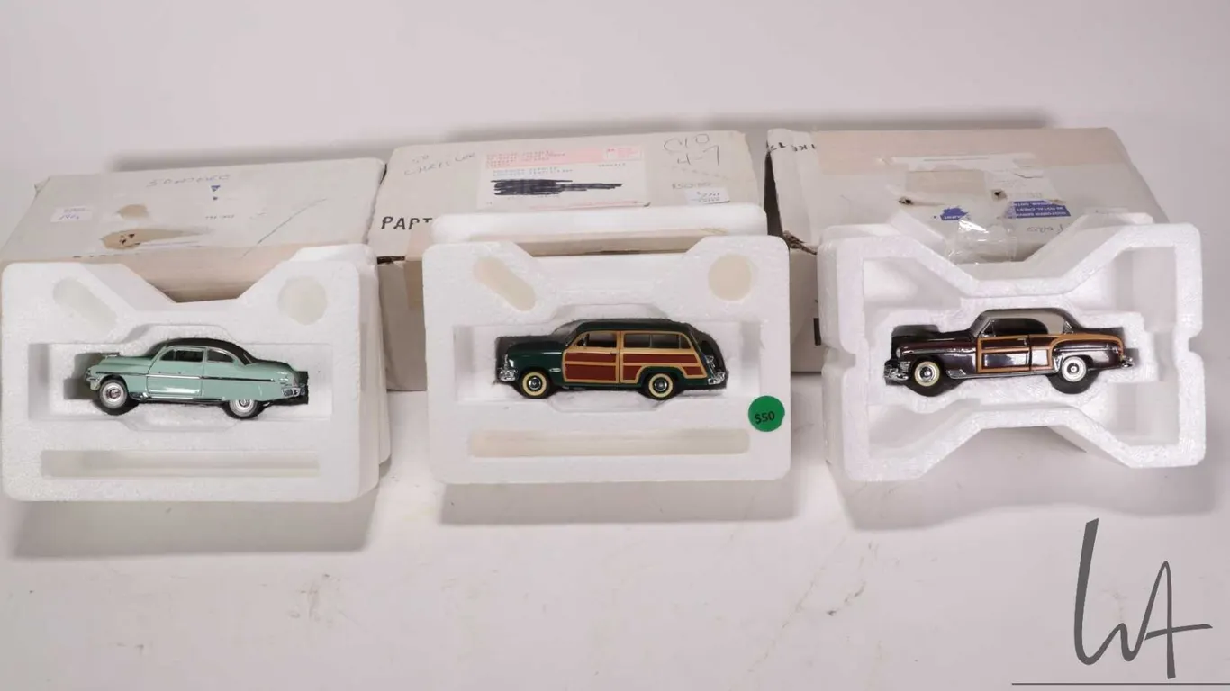 3 1:43 scale Franklin Mint die cast collectible cars including 1950 Ford Woody, 1950 Chrysler Town a