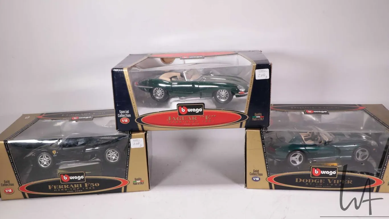 Three Burago die cast model cars including Jaguar E Cabriole 1961, 1993 Dodge Viper RT/10, 1995 Ferr