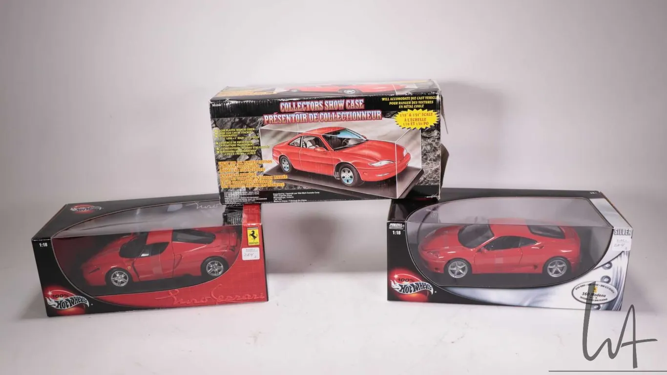 Two Hot Wheels die cast model cars including Silver Speed series Ferrari 360 Modena and a Ferrari En
