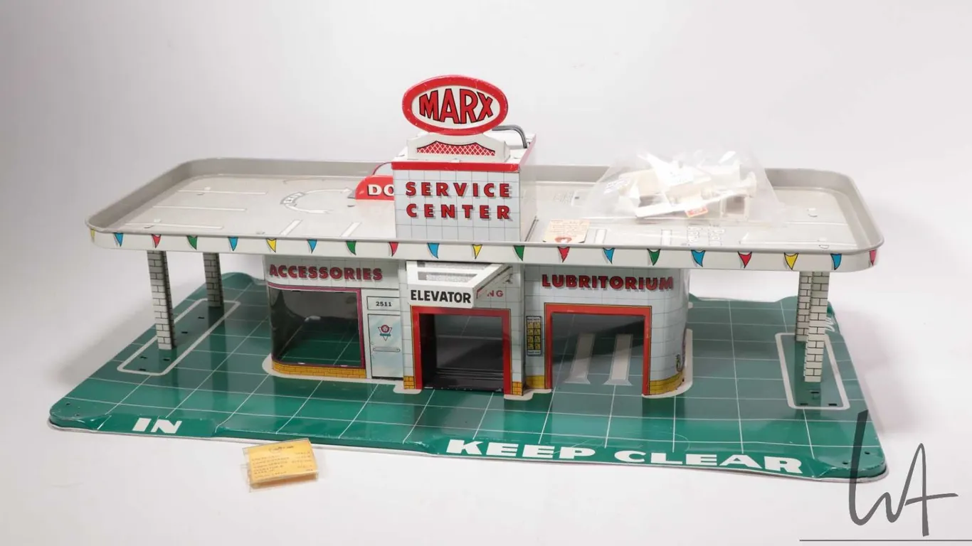 Vintage lithoed pressed tin 1960's Marx Service Center with accessories