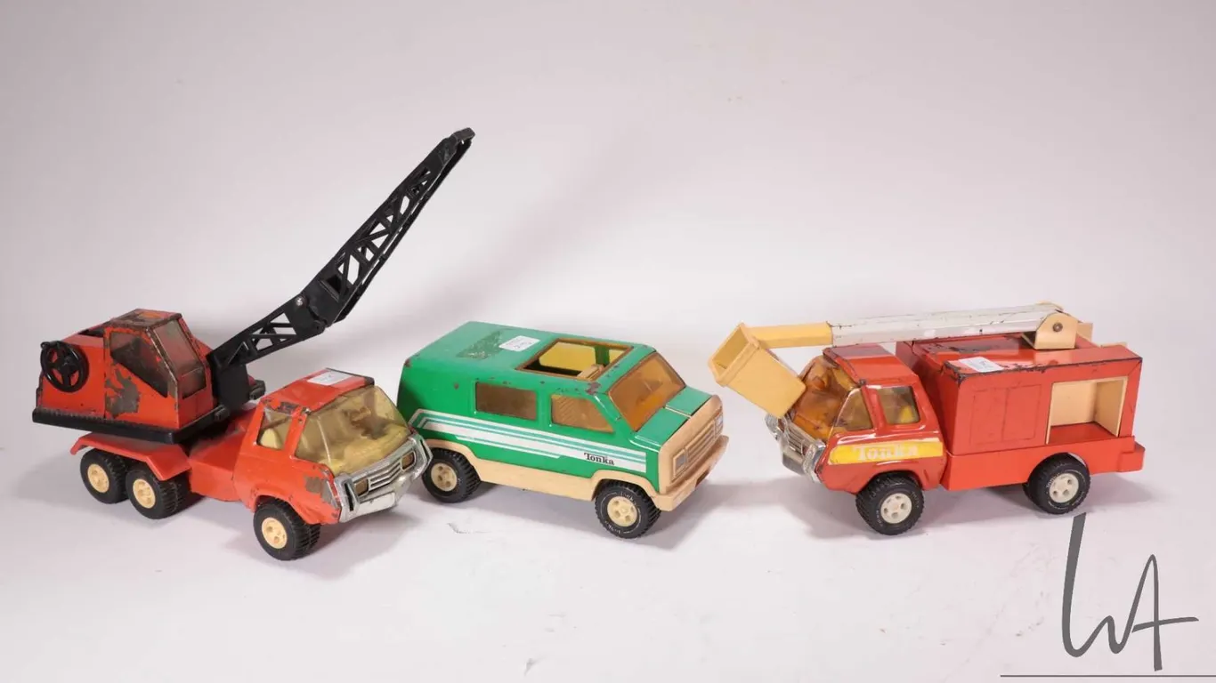 Three vintage Tonka trucks including cherry picker, a crane and a custom van
