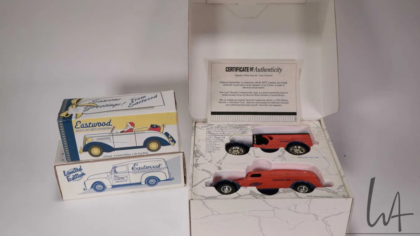 Two Ertl collectible die cast vehicles including Signature Edition 1: 25 scale Chevy 1923 and a 1938