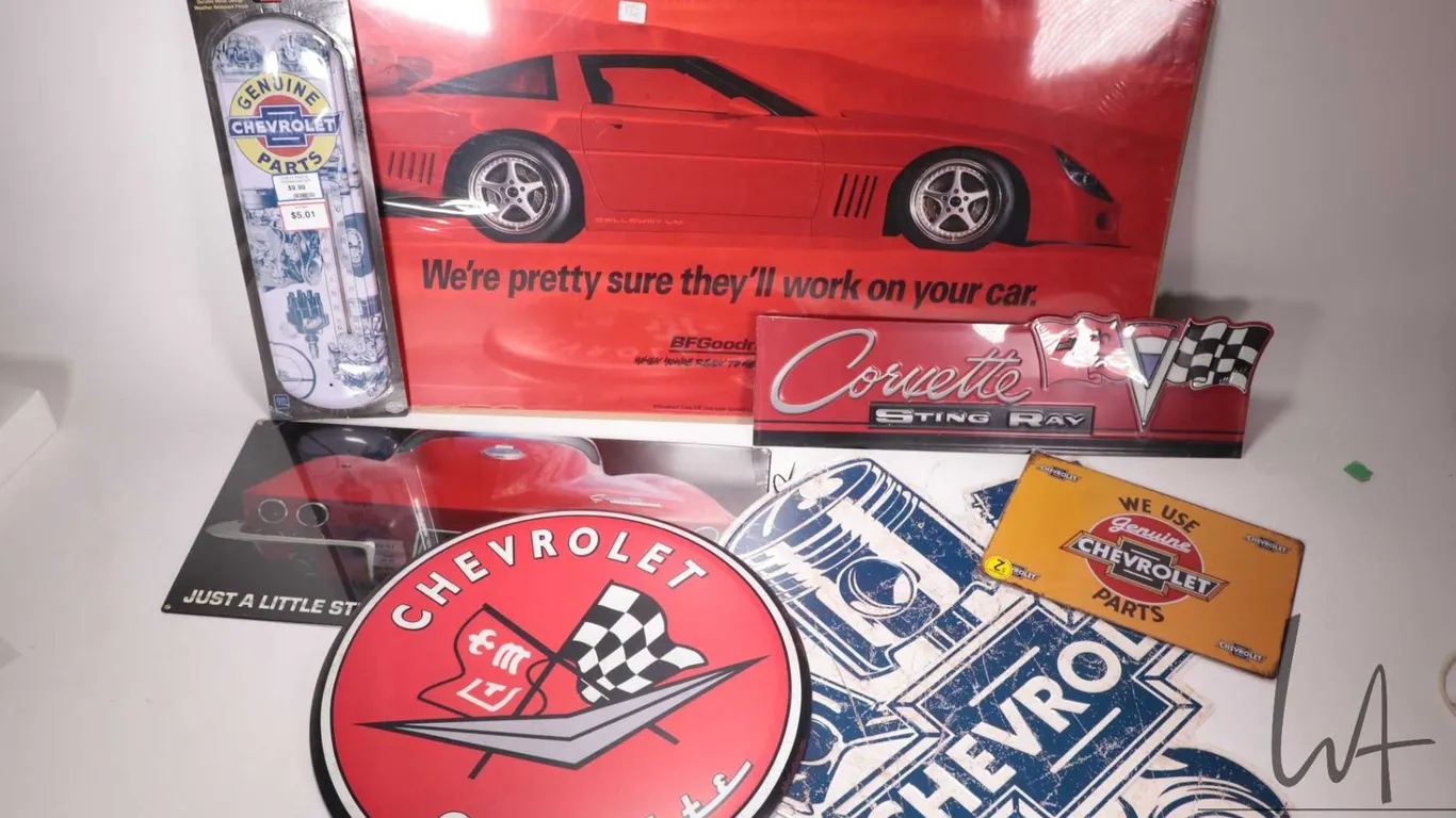 6 reproduction metal Chevy and Corvette wall signs, plus a BF Goodrich Corvette poster