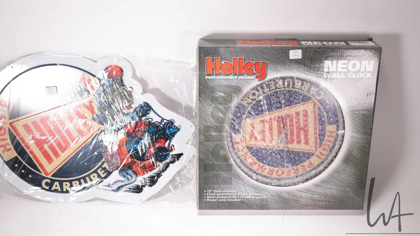 Holley Performance neon wall clock and a Holley Carburetors metal wall sign