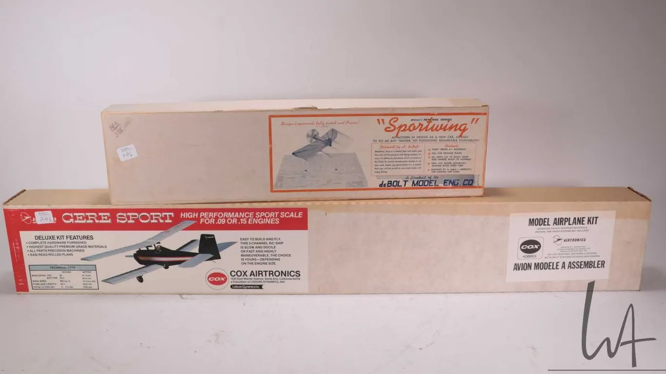 Two wooden airplane model kits including a Airtronics Cox Gere Sport and a deBotl Model Eng. Co. "Sp