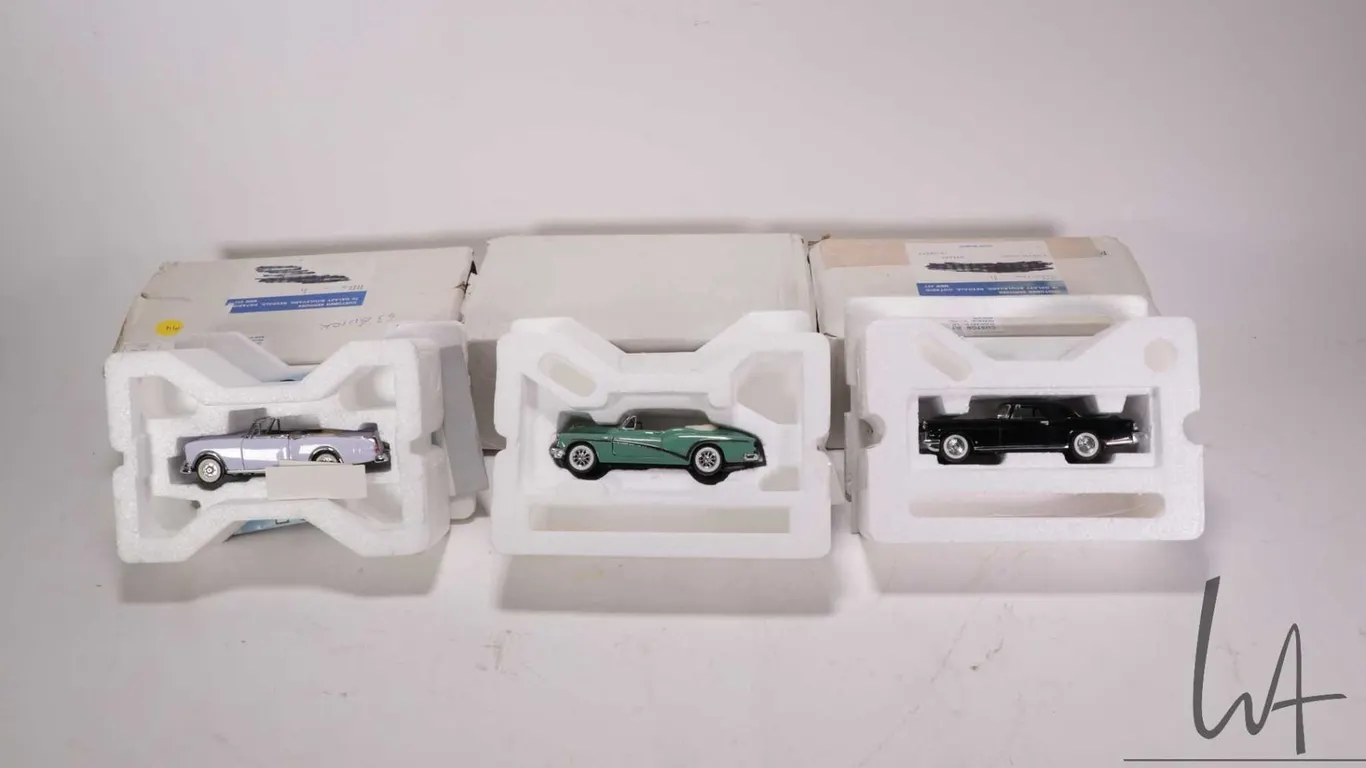 3 1:43 scale Franklin Mint die cast collectible cars including 1953 Packard Carribean, 1953 Buick Sk