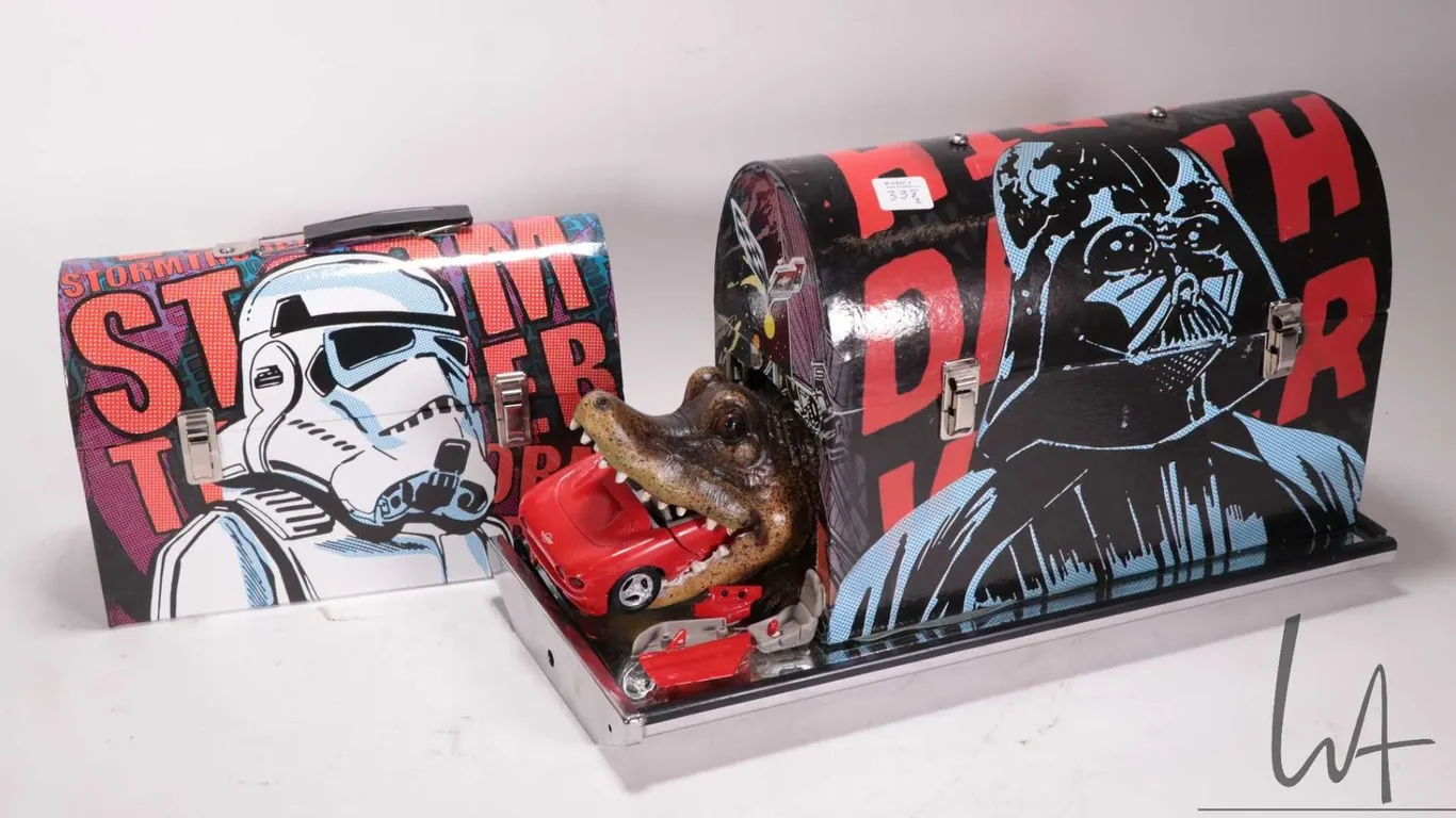 2 Star Wars themed lunch boxes, including one modified with a crocodile eating a Corvette, 16-1/2" l