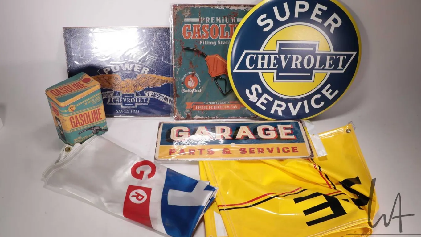 4 assorted reproduction metal wall signs, a reproduction buscuit tin, an NHRA racing flag, and a Pen