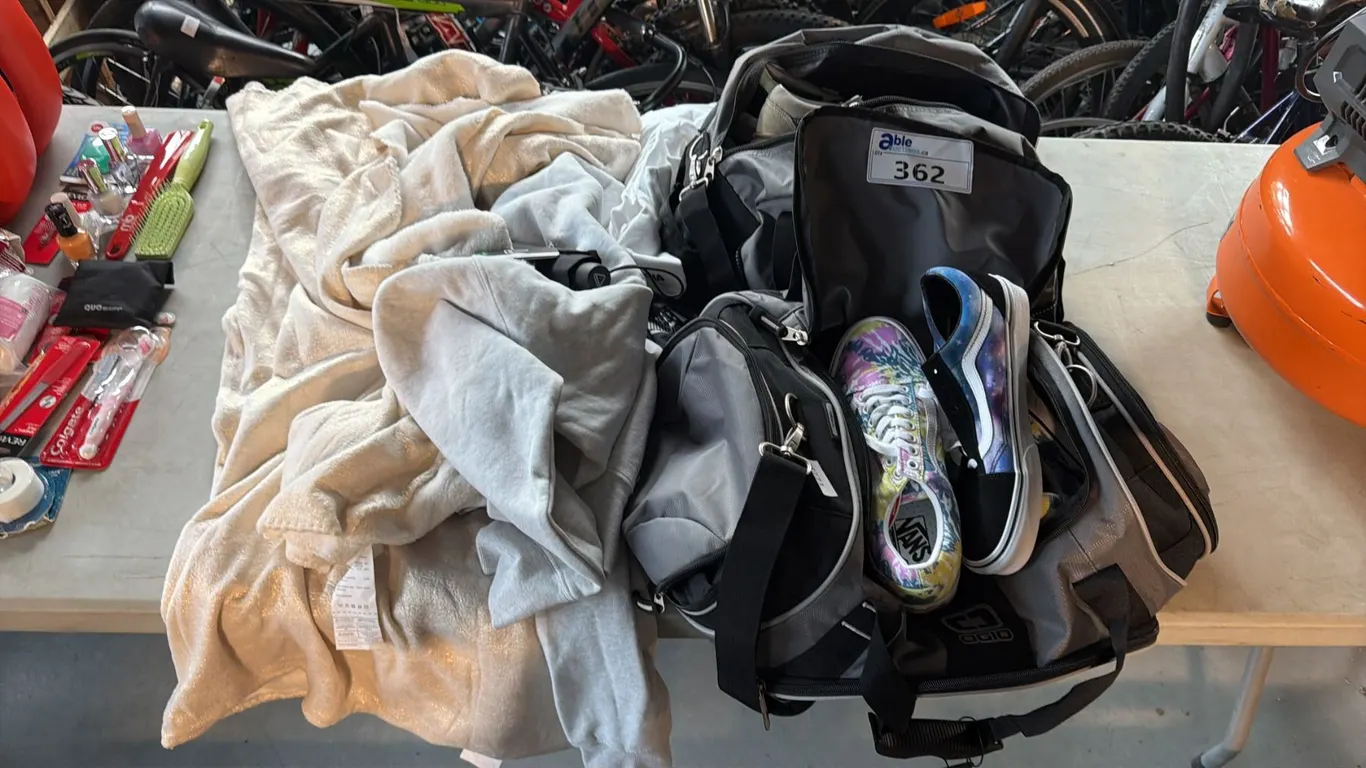 2 DUFFLE BAGS WITH ASSORTED SHOES & A HOODIE WITH BLANKET