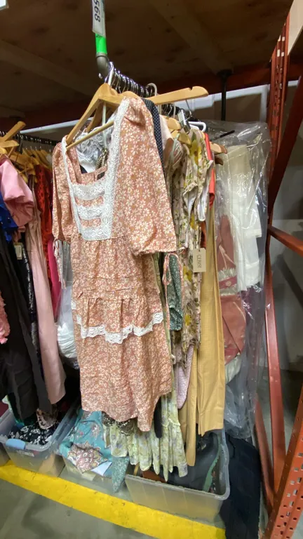 ONE RACK OF ASSORTED CLOTHING AND CURTAINS ) *RACK NOT INCLUDED*