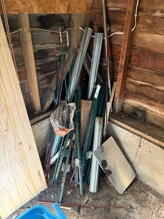 fence posts & iron pile in shed