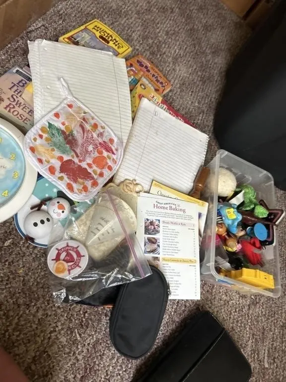 Books, knicknacks, clock, planner, etc