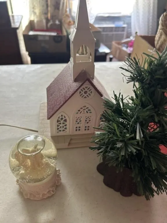A lineup, church, snug globe and a Christmas tree