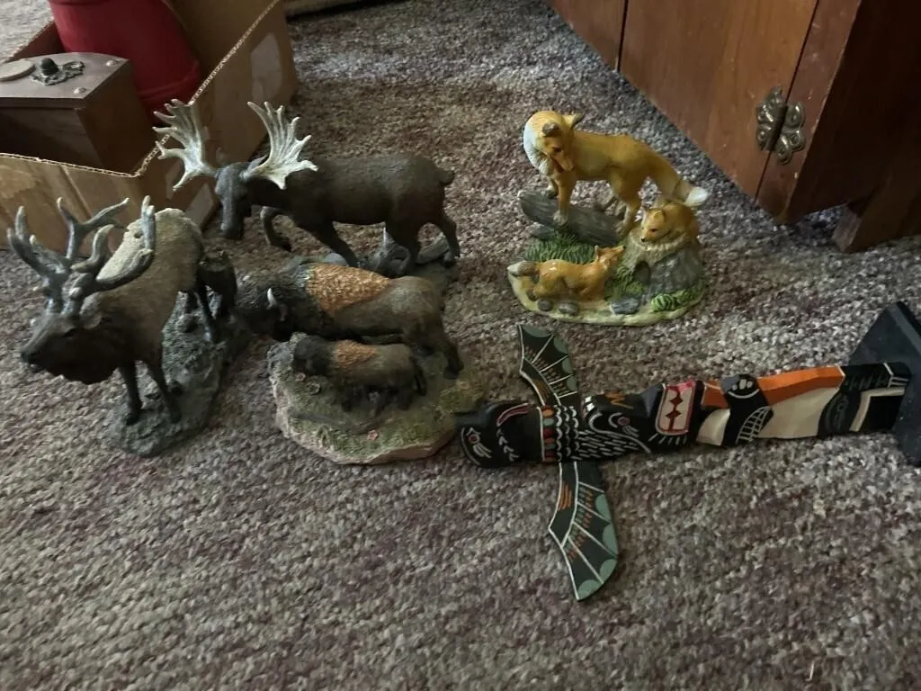 Ceramic animals in a wooden totem