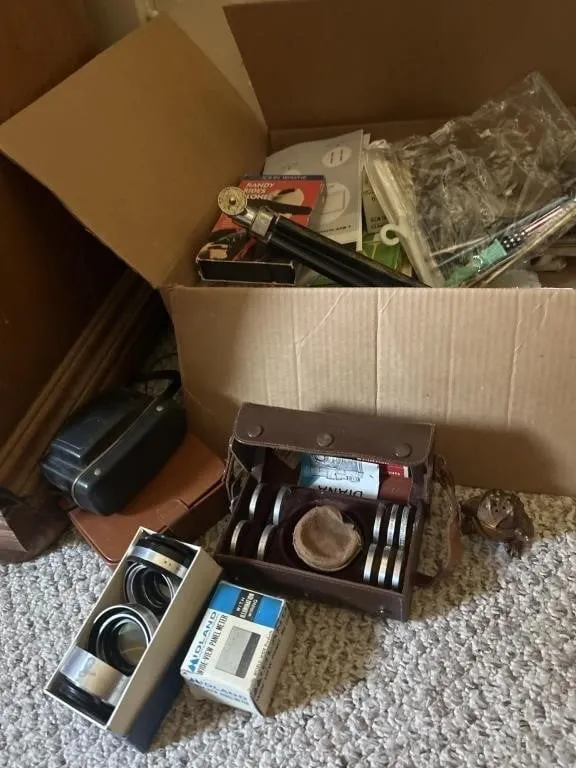 Books, camera lens, frog misc items