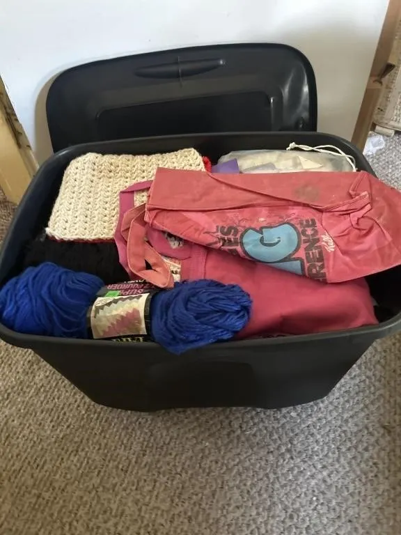 Tote with lid filled with yarn