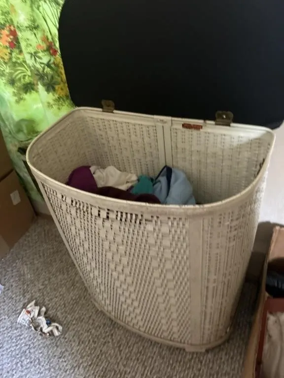 Laundry basket with crochet blanket, and clothes