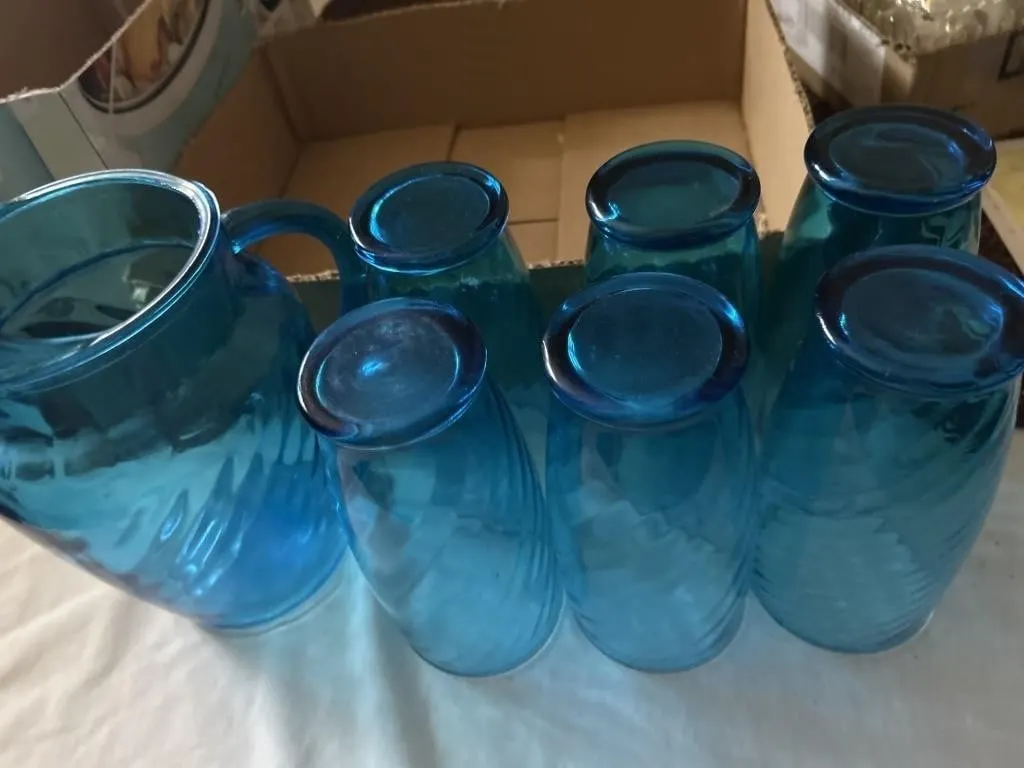 Blue glass cups and pitcher