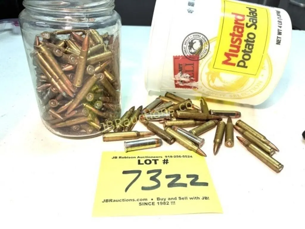 JAR OF 22 HORNET AND HANDFUL 223 AND 357 BULLETS