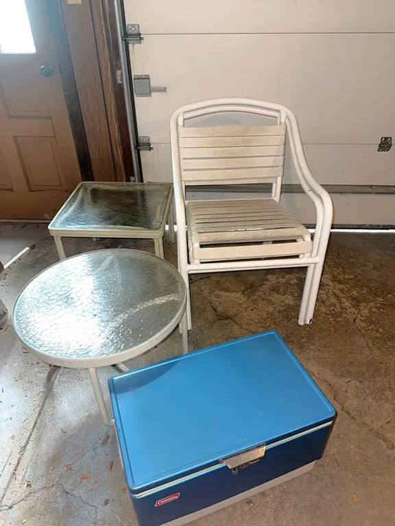 Two outdoor chairs, vintage Coleman cooler, etc.
