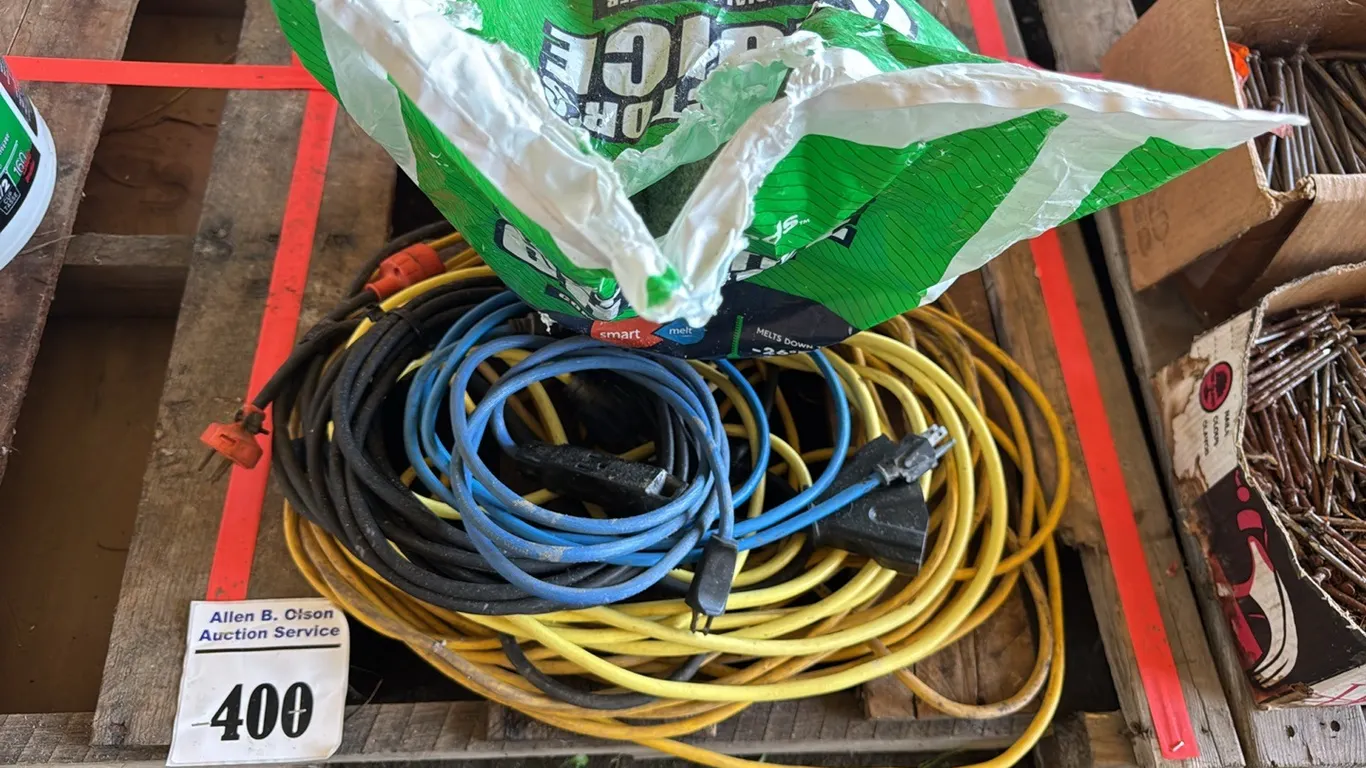 SEVERAL EXTENSION CORDS, PARTIAL BAG OF ICE MELT