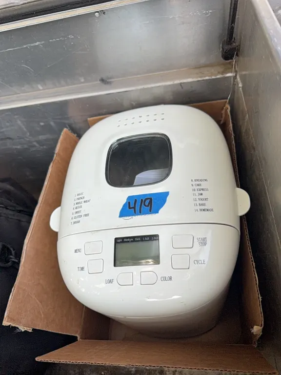 Bread maker, 2 lb. non stick, works great, has book with it